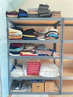 Full shelving unit showing all fabric stacks, pillows and boxes