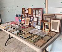 Overview of table with assorted frames and albums