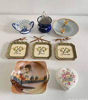 All eight porcelain and ceramic items laid out