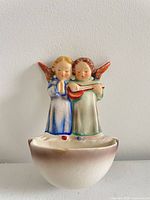 Front view of Goebel Hummel Angel Duet holy water font