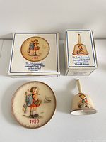 Plate, bell and both original boxes overview