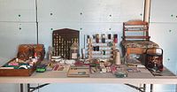 Full overview of entire sewing and needlework lot laid out on table
