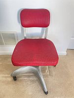 Front view of red upholstered office chair