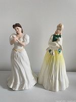 Front view of both Royal Doulton figurines Maria and Springtime