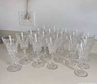 20 clear cut crystal stemware pieces grouped on countertop