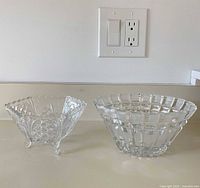 Both clear cut crystal bowls side by side