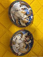 Front view of both round angel plaques