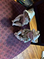 Both figurines shown seated on chair for scale and color view