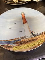 Front view of plate showing full lighthouse scene and gold rim