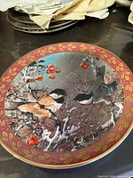 Front view of plate showing full winter bird design and border