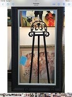 Full view of dark carved wood frame with linen liner