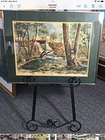 Full view of framed watercolour on easel