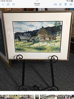 Framed watercolor on easel, full view