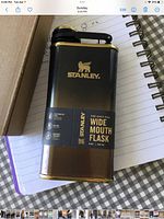 Front view of Stanley flask showing branding and label