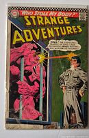Front cover of Strange Adventures #199 showing wear on spine, edges and corners