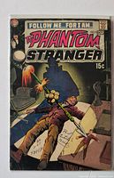 Front cover of The Phantom Stranger #9 comic showing artwork, price and issue number