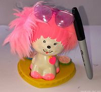 Front view of Poochie stamper with sunglasses and stamp discs