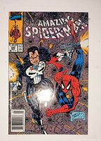 Front cover showing Punisher and Spider-Man battle scene, issue details and Marvel logo