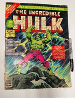 Front cover showing title, artwork, price and issue details with Sharpie for scale