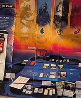 Overview of game poster and some cards for scale