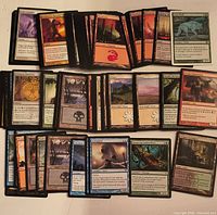Spread of Magic The Gathering cards showing variety of lands, spells and creatures