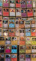 Binder pages showing rows of Pokémon cards