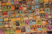 Wide view of assorted Pokémon cards spread out