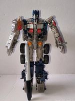 Full figure standing with marker for height reference