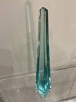 Full view of green glass obelisk