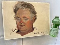 Front view of oil portrait on board next to water bottle for scale