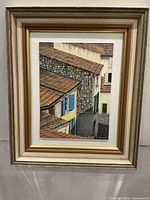 Framed painting showing full artwork within layered frame