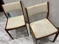 Front view of both D-Scan teak chairs