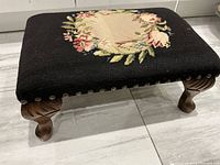 Overall view of needlepoint footstool