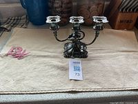 Full view of three-arm silverplate candelabra with lot tag