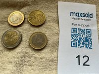 Obverse sides of four Euro coins showing denominations 1, 50, 2, 1