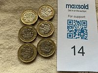 Six £1 coins reverse sides