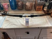 Full view of Barnett Lil Banshee youth compound bow on countertop