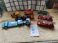 Group shot of all eight diecast vehicles on towel