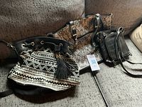 All three handbags on sofa