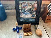 Lot overview: metal case, blue stopper, wooden shoe form, framed harbor print