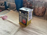 Front view of boxed 3-in-1 mosquito killer lantern