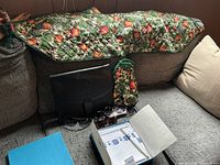 Overall lot showing runner on couch, briefcase, drawstring bag, sunglasses, boxed linens