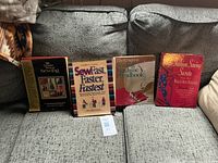 All four sewing instruction books on couch