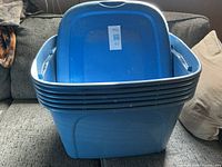 Front view of nested blue storage totes