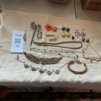 overall view of assorted jewelry laid out on cloth