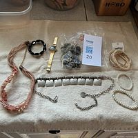 Overview of jewelry assortment laid out on cloth