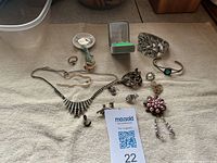Entire lot laid out on towel showing all jewelry pieces