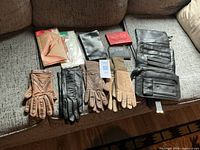 Group view of all gloves, wallets, pantyhose on sofa