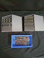 Overall view of two metal index boxes and blue tray of loose bits