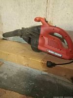Red Black & Decker leaf blower side view shows overall form and wear